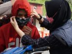 Cegah Lonjakan Kasus Covid-19, Ribuan Masker Dibagikan pada Petugas dan Pengendara